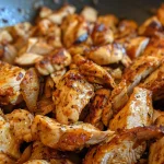 Close-up view of a juicy, spicy chicken breast cooked to perfection.