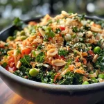 A vibrant bowl of Kimchi Gluten Free Crispy Rice Salad featuring kale, edamame, and colorful cherry peppers.