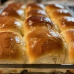 Close-up of gluten-free and dairy-free dinner rolls with a golden-brown crust.
