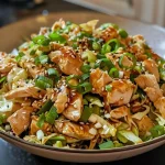 Close-up side view of a vibrant Keto Chinese Chicken Cabbage Stir-Fry in a bowl.