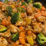 Close-up view of Sweet Chili Chicken Stir Fry with colorful vegetables.
