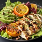 Juicy grilled honey mustard chicken tenderloins garnished with parsley and lemon slices.