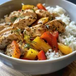 Close-up of a Chicken and Bell Peppers Rice Bowl with colorful bell peppers and rice.