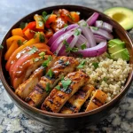Close-up of a BBQ Chicken Bowl featuring grilled veggies and sweet potatoes.