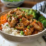 Close-up of a Teriyaki Chicken Rice Bowl with vibrant vegetables.