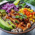 Close-up view of a BBQ chicken bowl topped with ranch dressing and fresh cilantro.