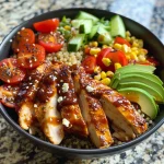 Close-up of a vibrant BBQ Chicken Power Bowl with colorful ingredients.