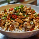 Juicy Cashew Chicken with colorful vegetables and cashews, served with jasmine rice.