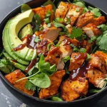 A vibrant Healthy BBQ Chicken Sweet Potato Bowl featuring tender chicken, orange sweet potatoes, and fresh toppings.