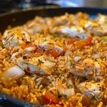 Close-up of One Pot Shawarma Chicken and Rice with golden-brown chicken and colorful vegetables.