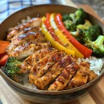 A balanced chicken and veggie power bowl featuring colorful vegetables and succulent chicken strips.
