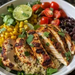['A vibrant bowl filled with chicken, quinoa, and fresh vegetables, captured from a side view.', 'Close-up view of a colorful Chicken Quinoa Bowl with greens, cherry tomatoes, and cooked chicken.', 'Side angle of a Chicken Quinoa Bowl showcasing layers of ingredients like black beans and corn.', 'A delicious Chicken Quinoa Bowl overflowing with healthy ingredients, photographed in natural light.']