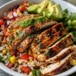 ['Close-up view of a grilled chicken burrito bowl with rice, beans, and fresh toppings.', 'Side view of a colorful burrito bowl featuring grilled chicken, avocado, and cheese.', 'Detailed shot of a grilled chicken burrito bowl showcasing layers of rice, beans, and vegetables.', 'Mouthwatering burrito bowl filled with grilled chicken, salsa, and diced bell peppers.']