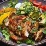 ['Close-up of grilled chili lime chicken breasts with vibrant lime zest.', 'Juicy grilled chicken coated in a spicy chili lime marinade, garnished with lime slices.', 'Side view of succulent grilled chili lime chicken on a wooden plate.', 'Freshly cooked grilled chicken marinated in chili and lime, showing juicy texture.']