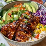 ['Close-up view of Hot Honey Chicken served on quinoa with fresh vegetables.', 'Juicy chicken thighs drizzled with hot honey atop a bed of quinoa and garnished with greens.', 'Vibrant quinoa bowl featuring hot honey chicken, sliced peaches, and avocado slices.', 'Horizontal image showcasing hot honey chicken alongside colorful quinoa and fresh ingredients.']