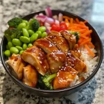 ['Close-up view of a Teriyaki Chicken Power Bowl filled with vibrant vegetables and chicken.', 'Side perspective of a colorful Teriyaki Chicken Power Bowl, showcasing fresh ingredients.', 'Juicy Teriyaki Chicken Power Bowl highlighting a medley of vegetables and sauces.', 'Detailed view of a Teriyaki Chicken Power Bowl with pieces of chicken and assorted veggies.']